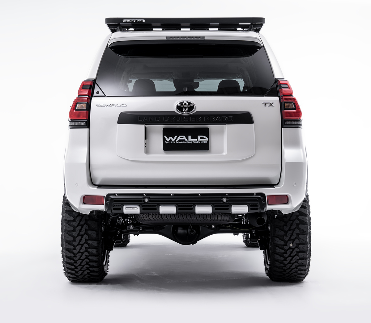 WALD Desert Line Land Cruiser Prado head-on rear studio view with rear bumper garnish and WALD emblem
