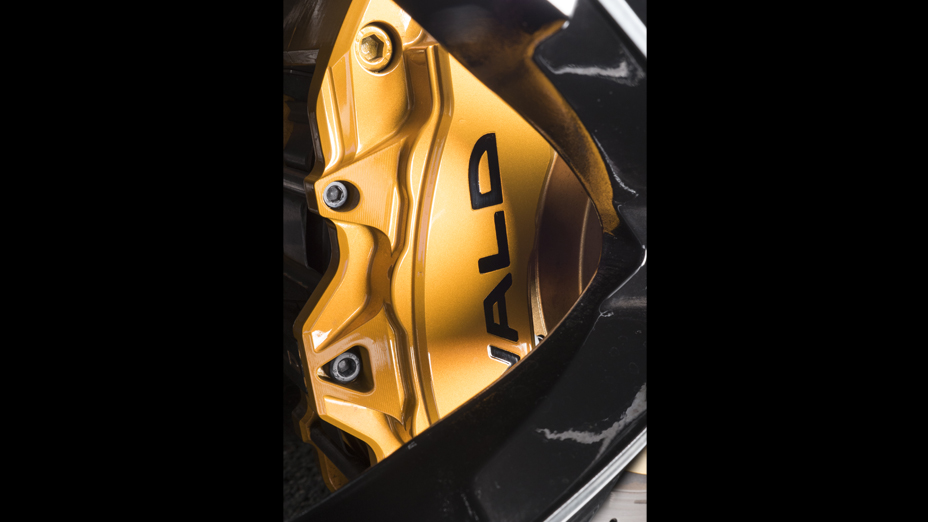 WALD upgrade brake system on Land Cruiser 200 — gold 8-piston caliper behind JARRET monoblock wheel