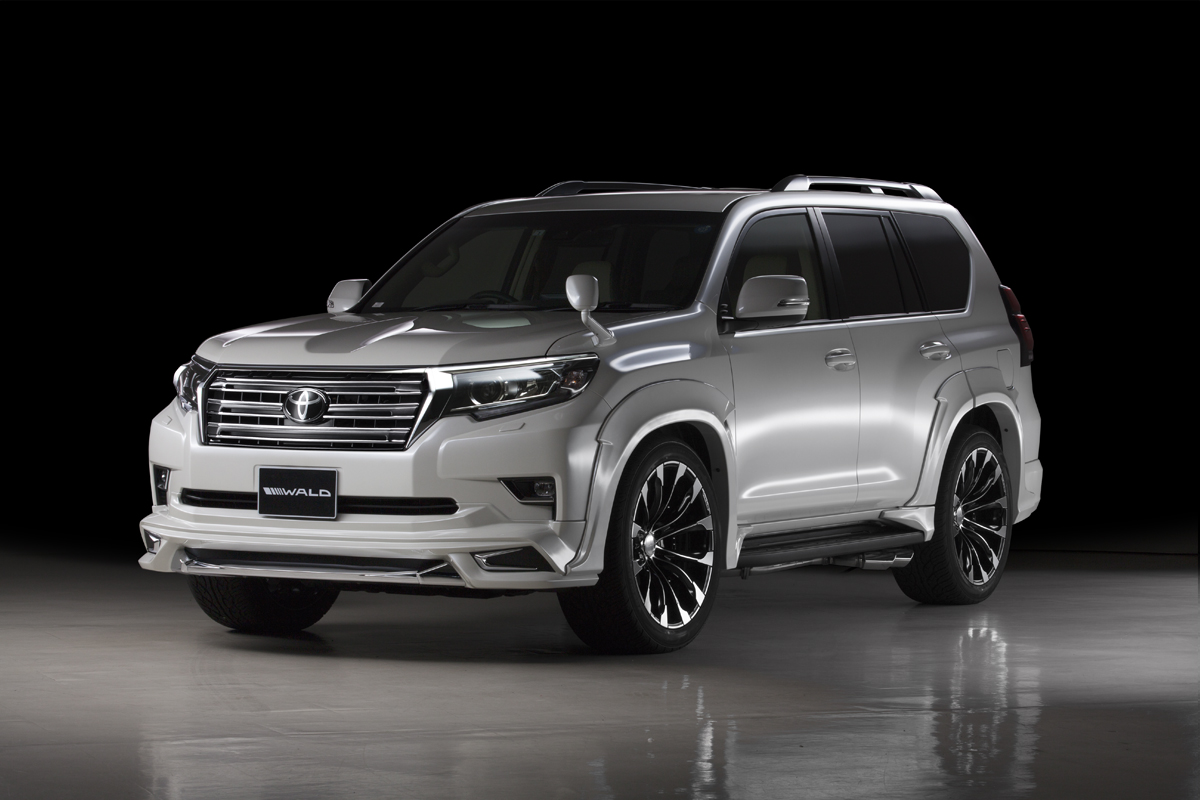WALD Sports Line Land Cruiser Prado 150 studio front three-quarter view with front spoiler, front grille and WALD wheels