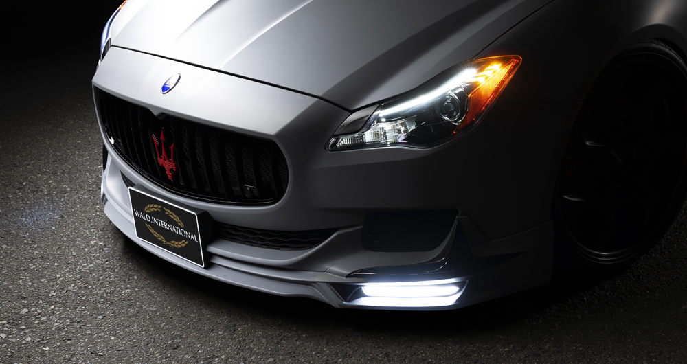 WALD Maserati Quattroporte front spoiler with LED daytime running lamps illuminated