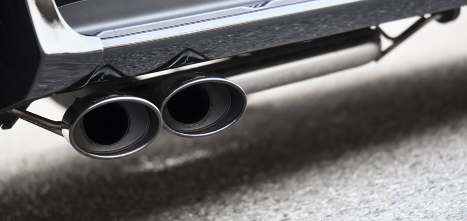Close-up of the WALD Lexus LX570 twin oval stainless steel exhaust tips beneath the rear skirt
