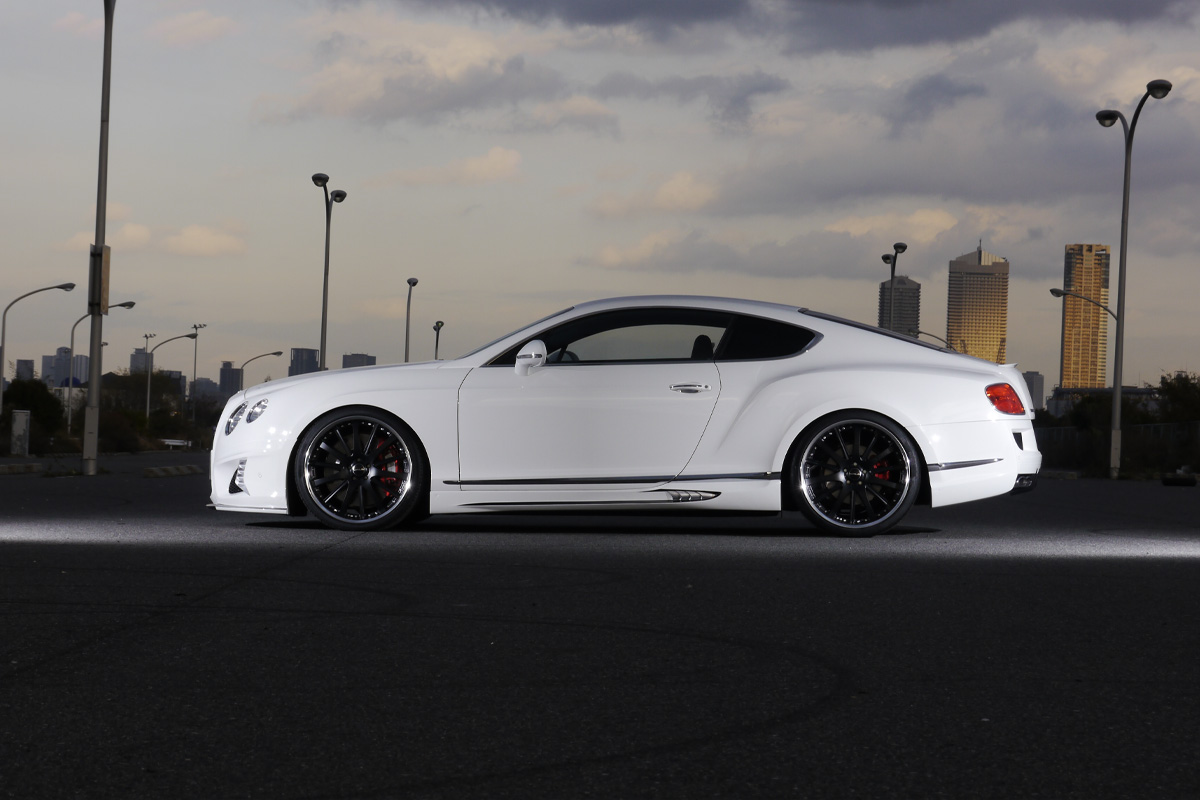 WALD Bentley Continental GT Black Bison body kit — full side profile showing lowered stance and WALD side skirts