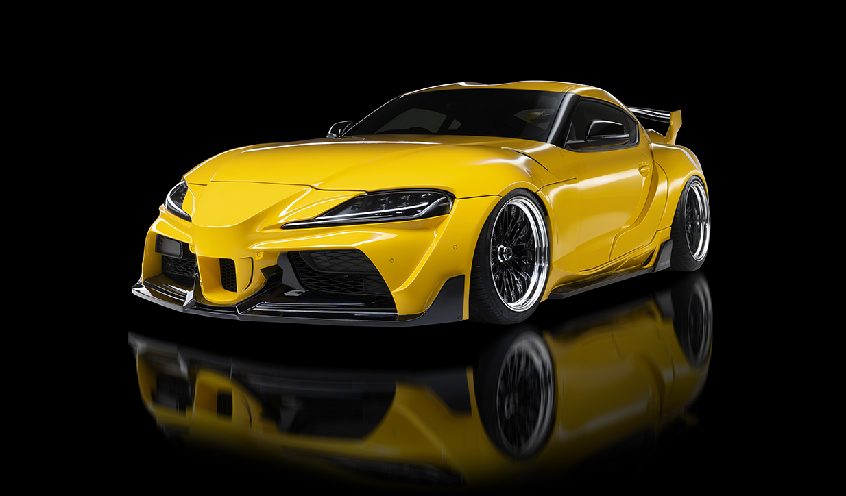 WALD Sports Line Wide Body Toyota Supra DB## in yellow with front bumper spoiler, wide fenders and 3D rear wing