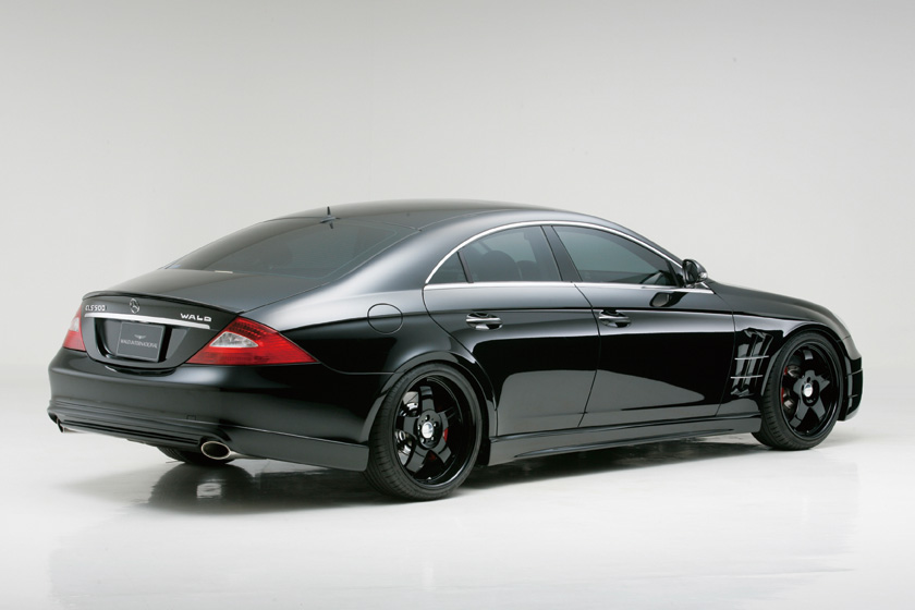 WALD Sports Line Mercedes-Benz CLS-Class C219 black rear three-quarter studio view with WALD rear skirt, WALD lettering and sports fender duct