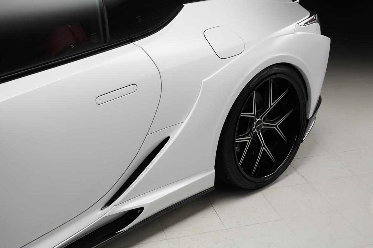 WALD Lexus LC500 rear wide fender and side skirt detail on a white LC500 with WALD wheel