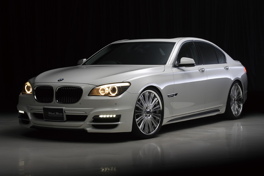 WALD BMW 7 Series M Sport F01 F02 Black Bison body kit 2009–2015 — white saloon front three-quarter studio view