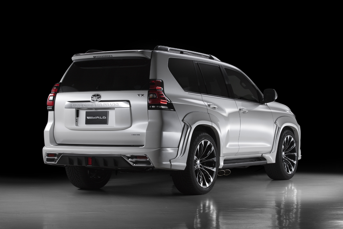 WALD Sports Line Land Cruiser Prado 150 rear three-quarter studio view with rear skirt, chrome garnish and dual oval exhaust tips