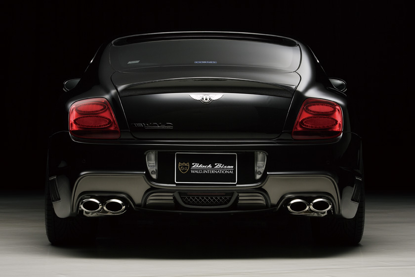 WALD Bentley Continental GT rear body kit 2008–2010 — studio rear view with Black Bison rear bumper spoiler, boot spoiler and quad exhaust tips