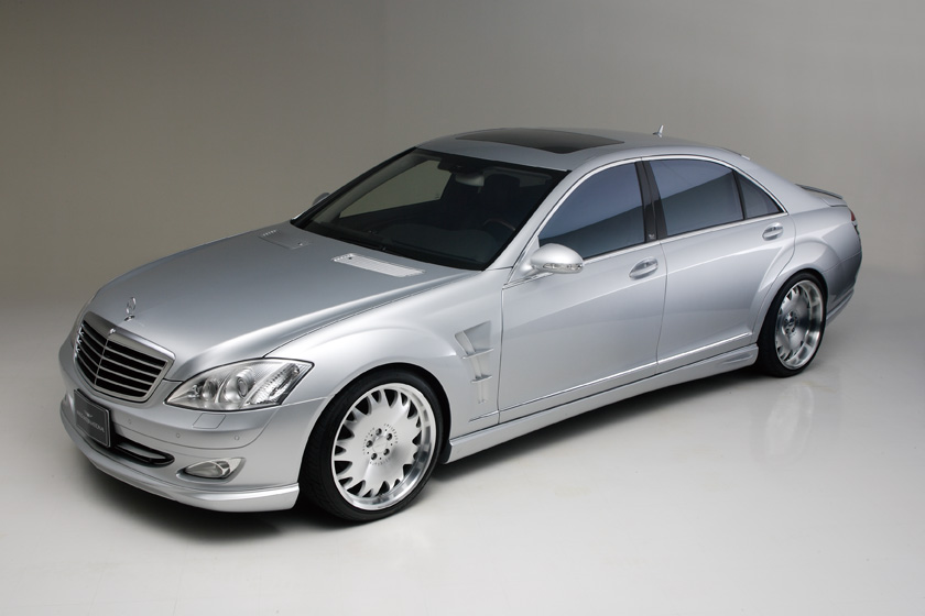 Silver Mercedes-Benz S-Class W221 WALD Executive Line studio front three-quarter view with side skirts and WALD forged wheels
