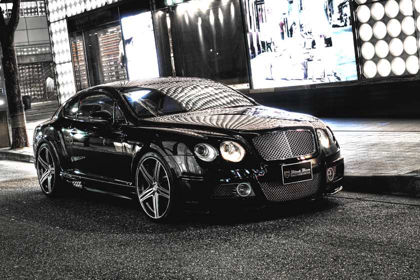 Black Bentley Continental GT WALD Black Bison Edition on MAHORA M11C wheels at night
