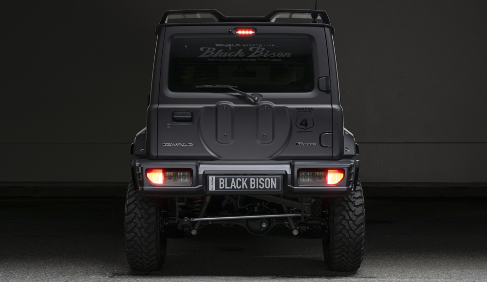 WALD Black Bison Edition Suzuki Jimny JB74W — head-on rear view with rear gate spare tyre cover, rear bumper spoiler and Black Bison plate