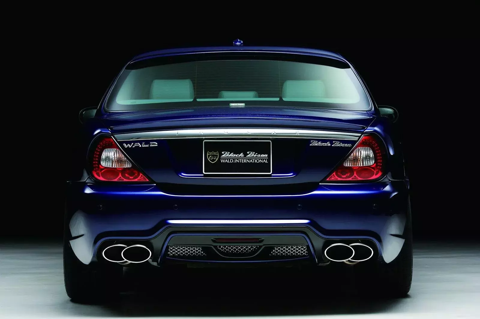 WALD Black Bison Jaguar XJ X350 X358 rear view with Black Bison badging and quad oval exhaust tips