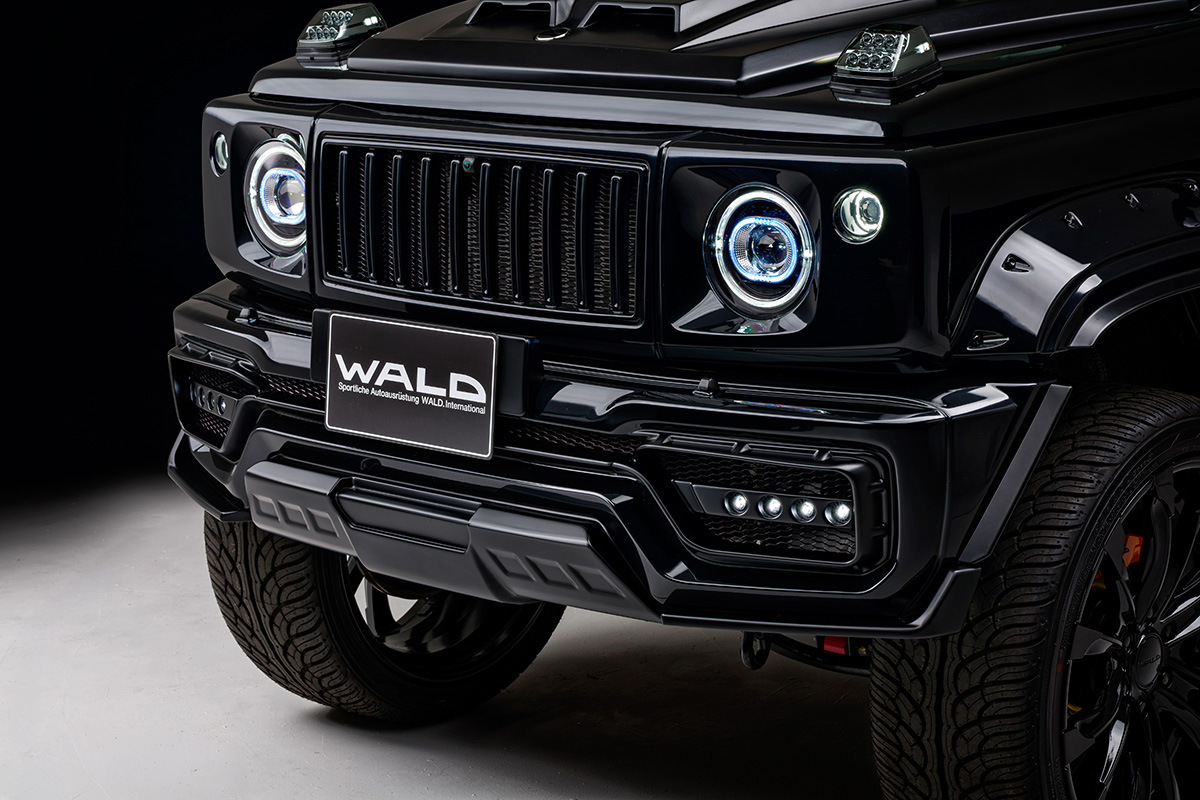 WALD Black Bison Edition Suzuki Jimny Nomade JC74W — close-up of the front bumper spoiler, 4pc LED lamp units and Japamericana grill with headlight covers
