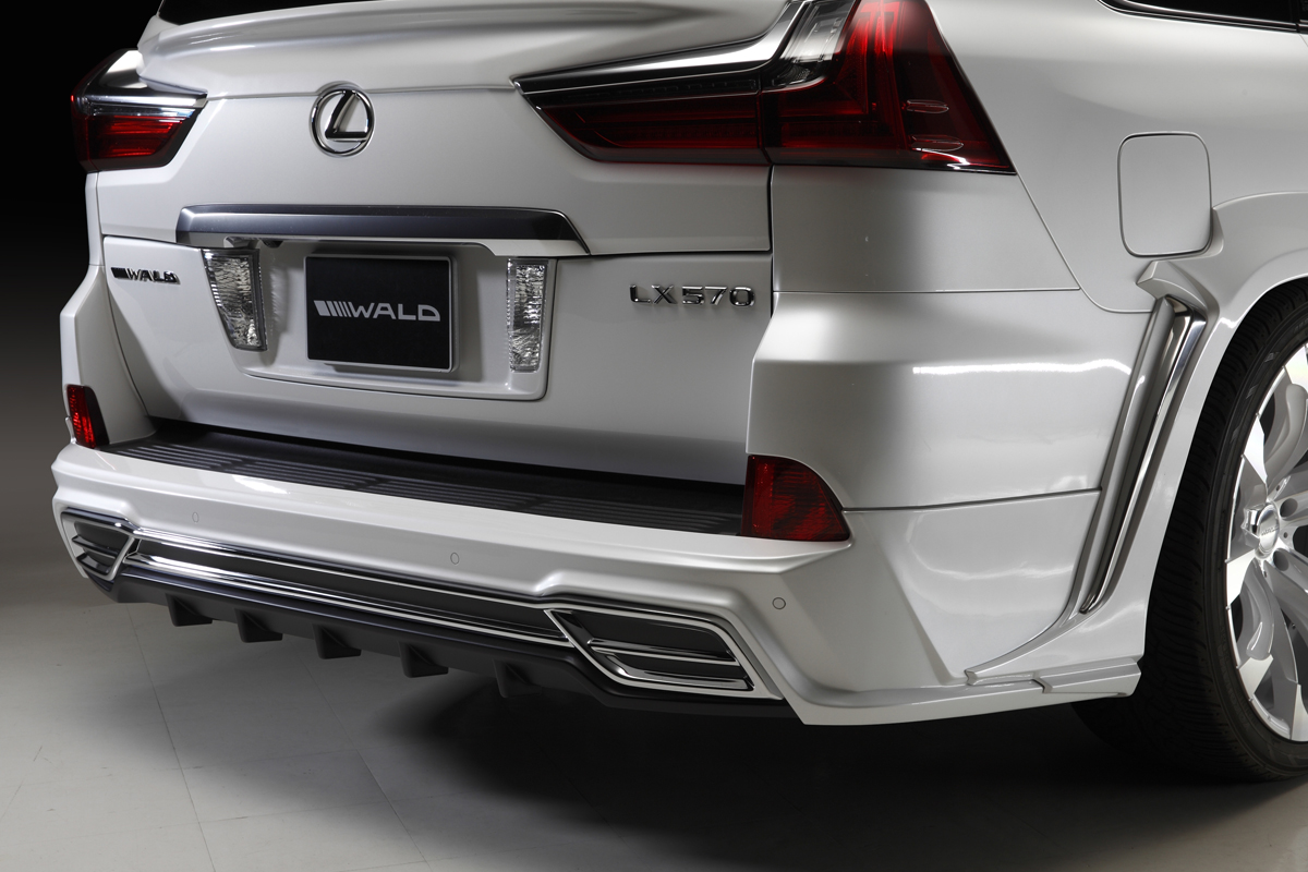 WALD Lexus LX570 rear skirt detail — plated garnish, muffler adaptor and rear wide arch chrome garnish