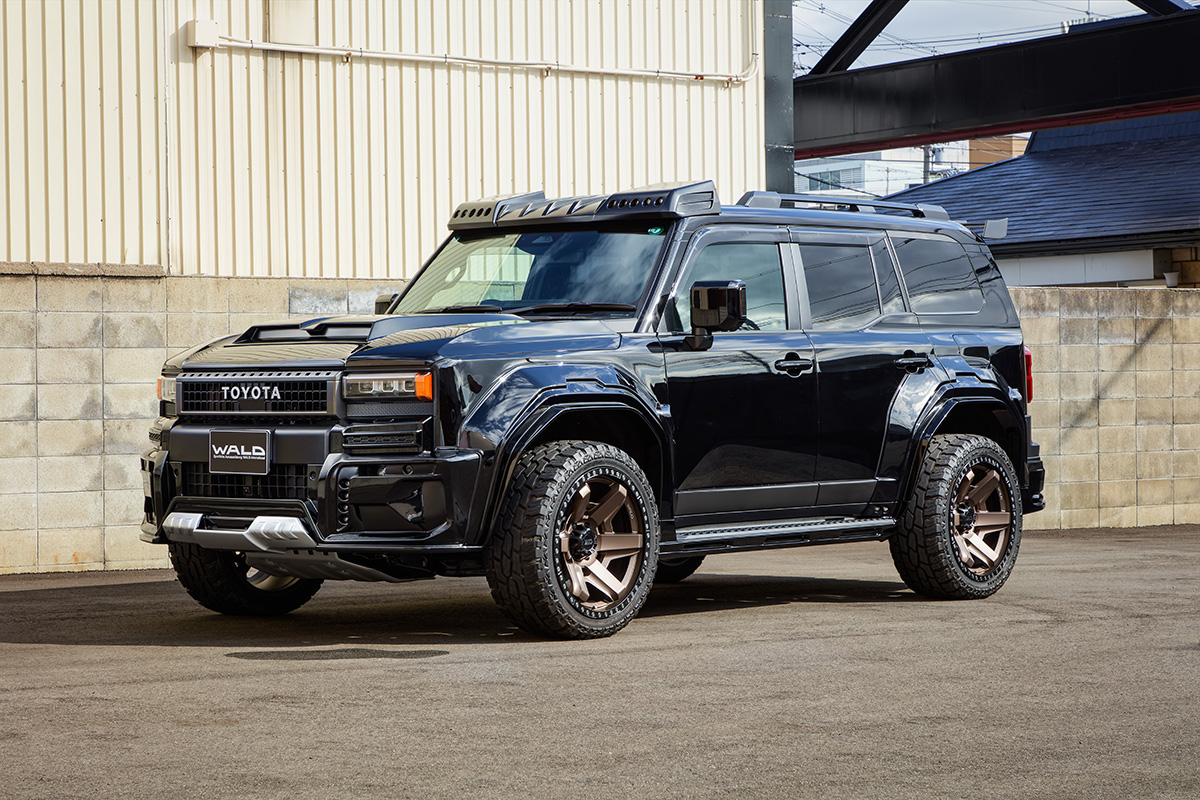 WALD Black Bison Toyota Land Cruiser 250 Prado front three-quarter view with wide arch package and bronze WALD wheels