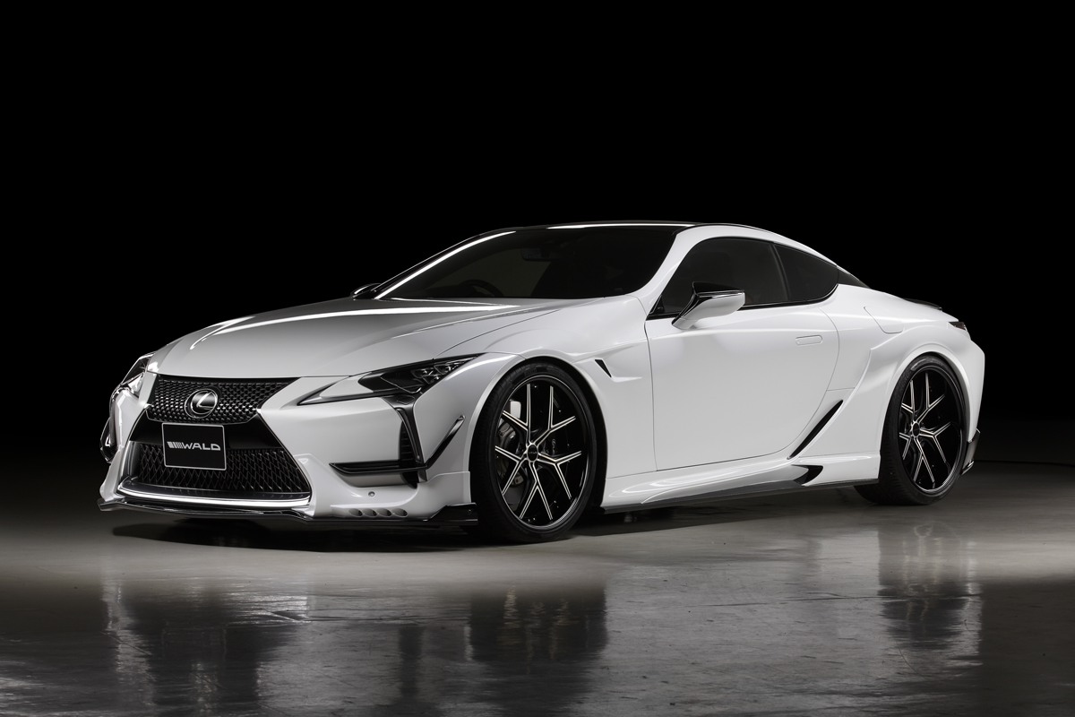 WALD Sports Line Lexus LC500 LC500h GWZ100 URZ100 — white LC500 front three-quarter studio view with WALD front spoiler, side skirts and wide rear fenders