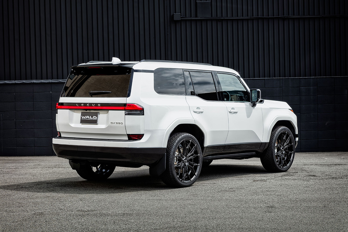 White Lexus GX550 with WALD ELDORANTE E11C 24-inch wheels — rear three-quarter view