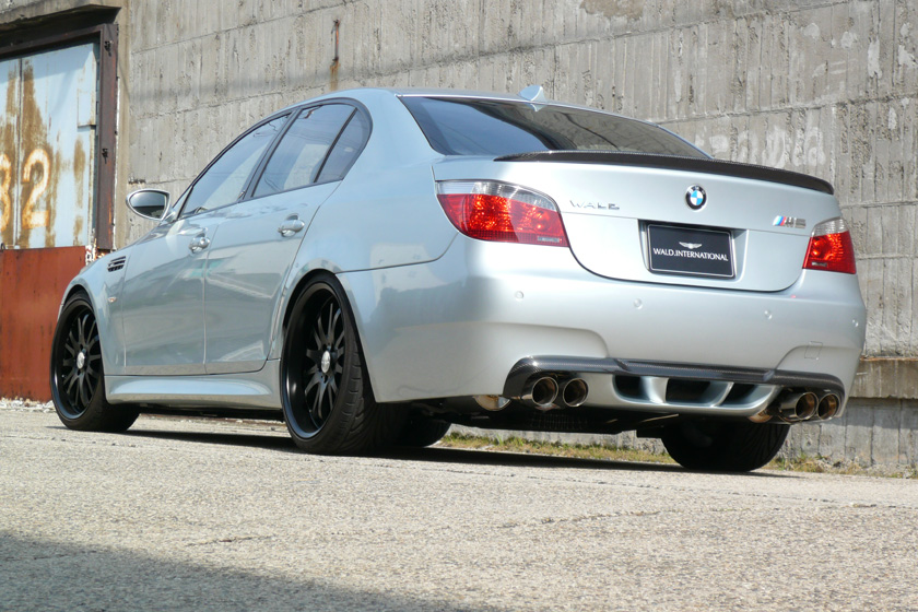 WALD BMW M5 E60 rear three-quarter view showing WALD rear bumper spoiler and boot spoiler