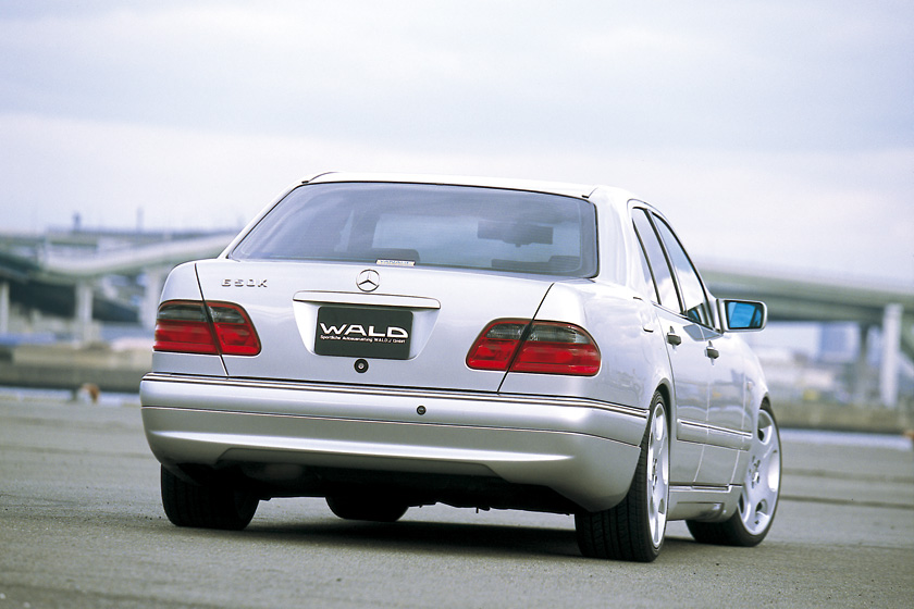 Mercedes-Benz E-Class W210 WALD Executive Line rear three-quarter view on the quayside