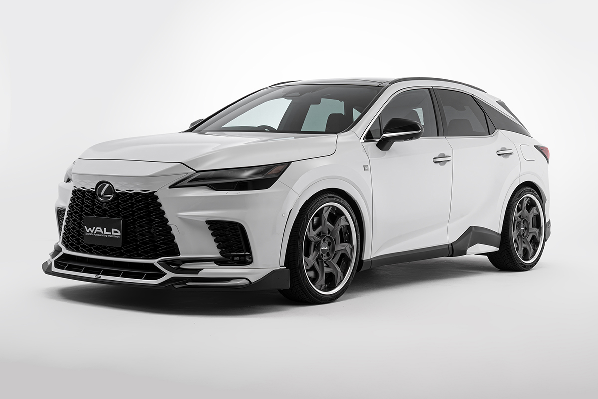WALD Sports Line Lexus RX body kit — white Lexus RX500h F SPORT front three-quarter studio view with WALD front spoiler