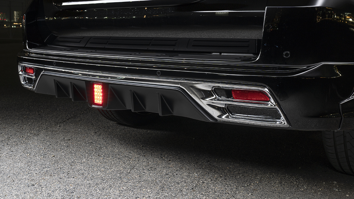 WALD Black Bison Edition Prado 150 rear skirt detail with chrome garnish, LEDBGL175 lamp and side exit exhaust outlets