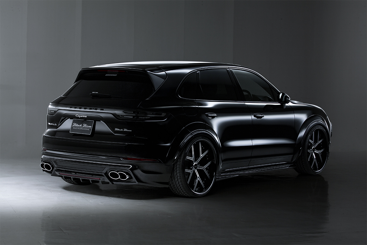 WALD Porsche Cayenne rear skirt — black Cayenne 9YA rear three-quarter view with WALD rear skirt and quad exhaust tips