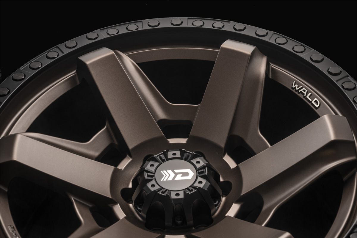 Close detail of the WALD DS001 Matte Bronze Black spokes and WALD lettering