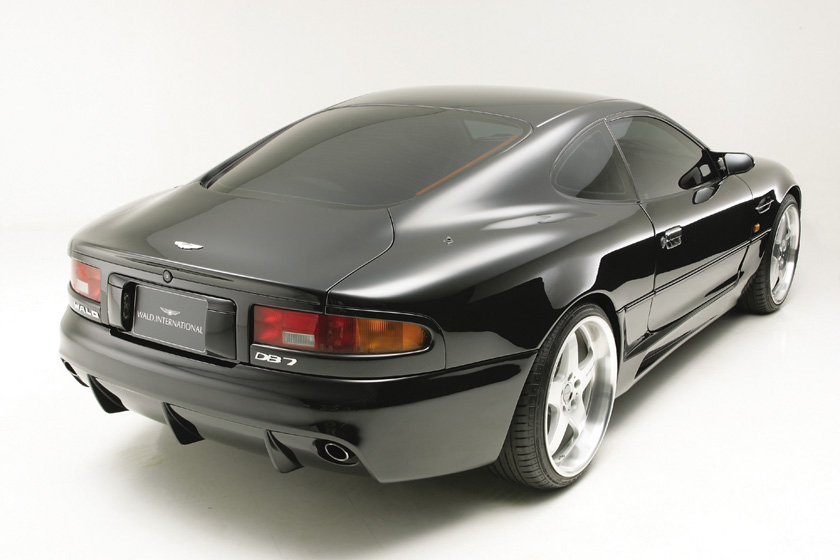 WALD Aston Martin DB7 rear bumper spoiler — black DB7 rear three-quarter view with WALD rear diffuser and exhaust outlet