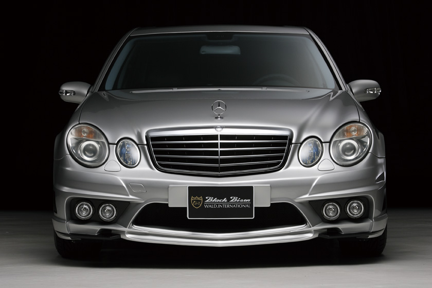 Mercedes-Benz E-Class W211 WALD Black Bison front bumper spoiler head-on studio view with fog lamps