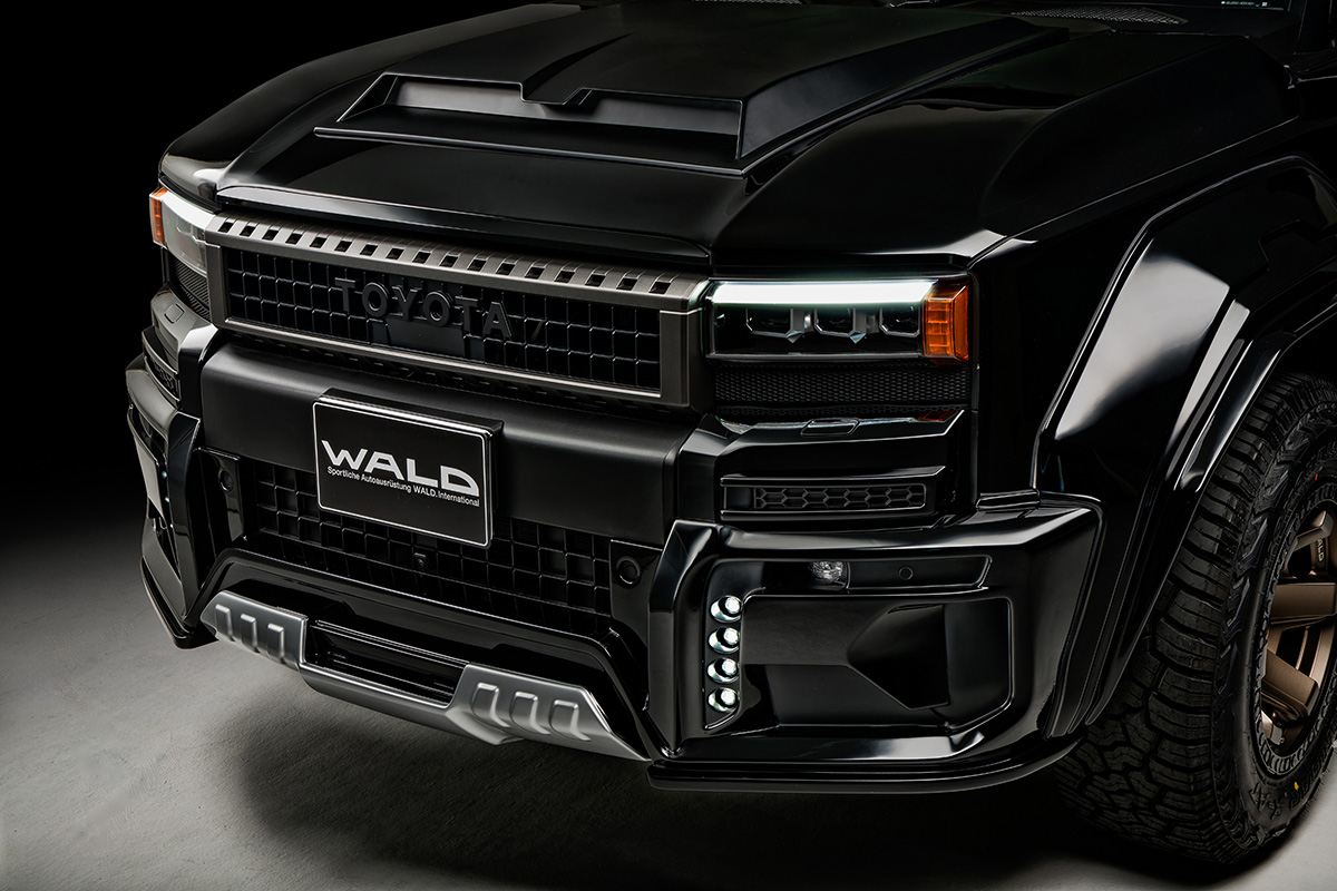 WALD Black Bison Land Cruiser 250 Prado front bumper detail with bonnet scoop, LED lamps and WALD plate
