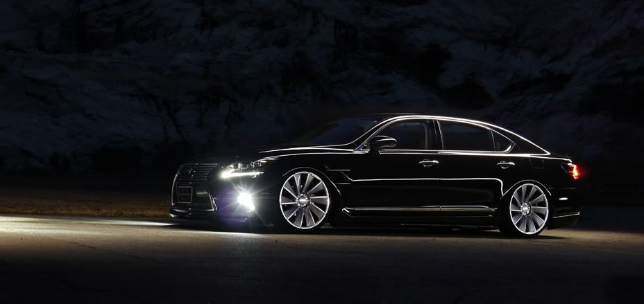 WALD Executive Line Lexus LS460L side view at night with headlights lit and WALD side skirts