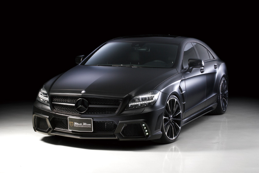 WALD Black Bison Mercedes-Benz CLS C218 body kit — black CLS-Class coupé with WALD front bumper spoiler and sports fender ducts