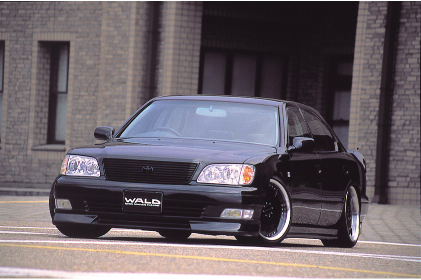 WALD Sports Line V2 Toyota Celsior UCF20/21 — black Celsior front three-quarter view with WALD front spoiler and deep-dish wheels