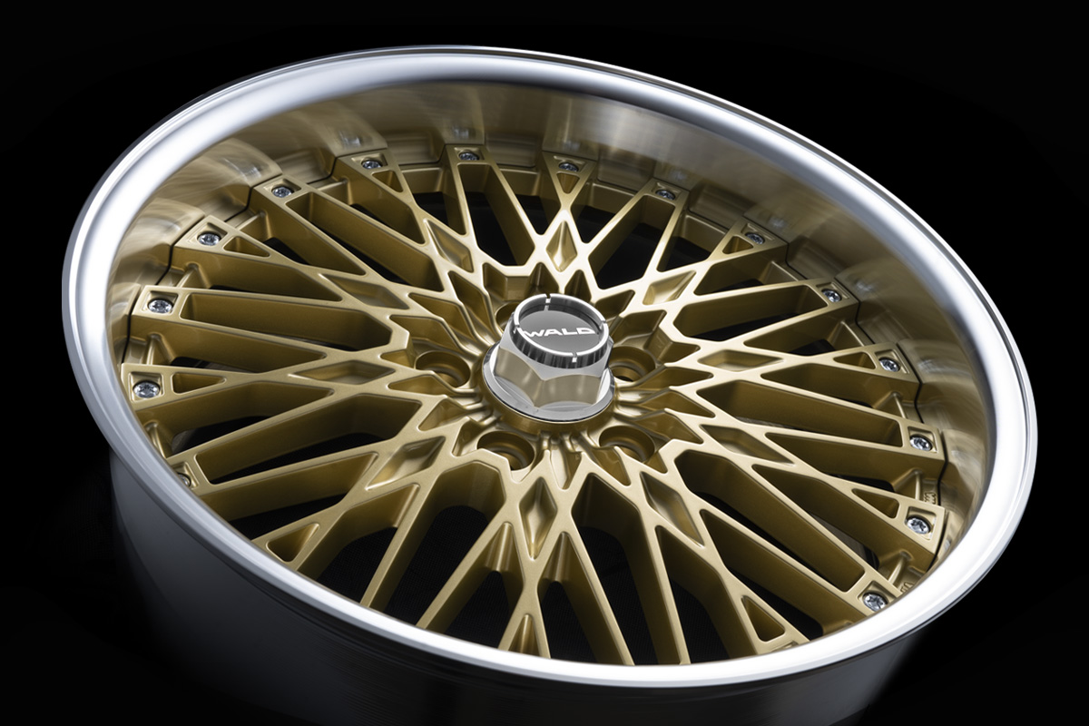 WALD Classic Mesh CM12C in Gold with polished rim and hex WALD centre cap, angled studio view