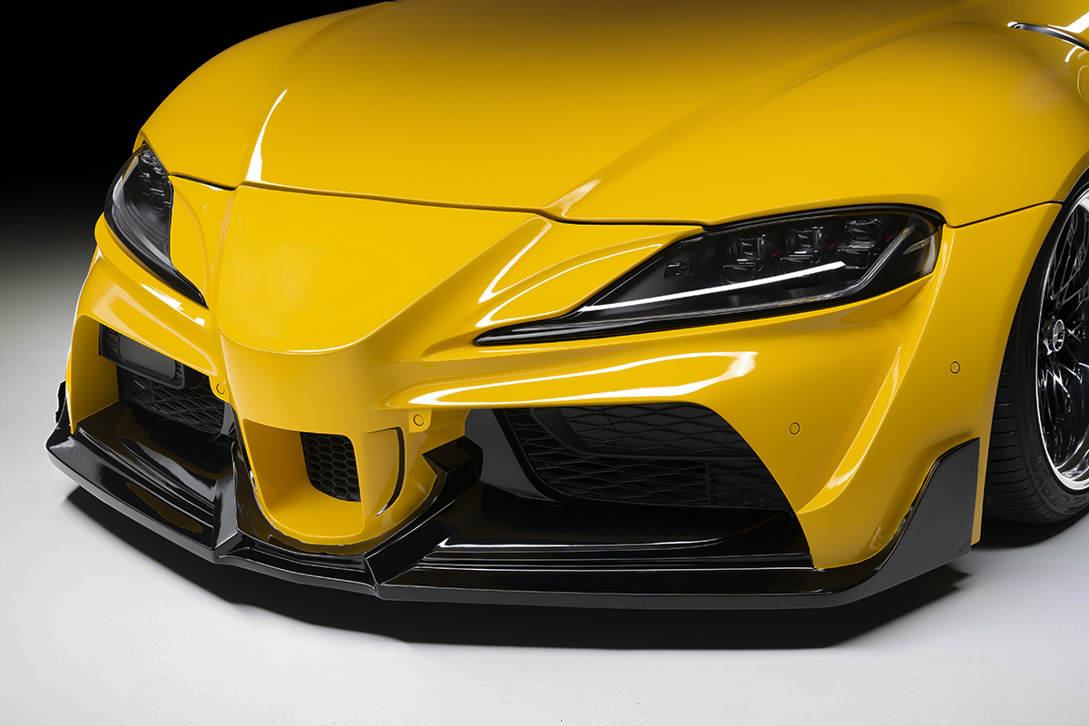 WALD front bumper spoiler detail on the Toyota Supra DB## with mesh insert and gloss black lip