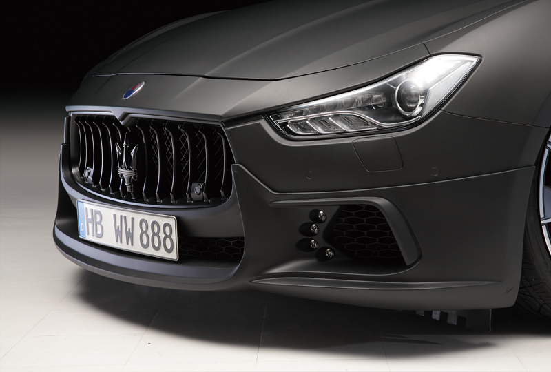 WALD Maserati Ghibli front lip spoiler detail — LED lamp and licence plate bracket close-up