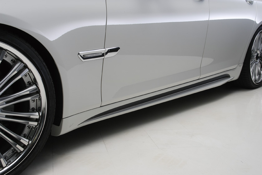 WALD BMW 7 Series F01 Black Bison side skirt detail on silver M Sport saloon with WALD forged wheels