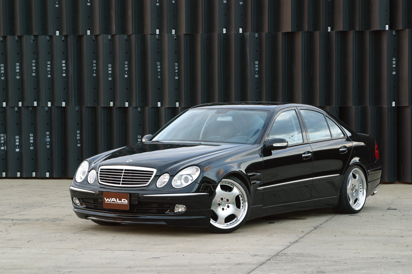 Mercedes-Benz E-Class W211 WALD Executive Line front three-quarter view showing side skirts and lowered stance