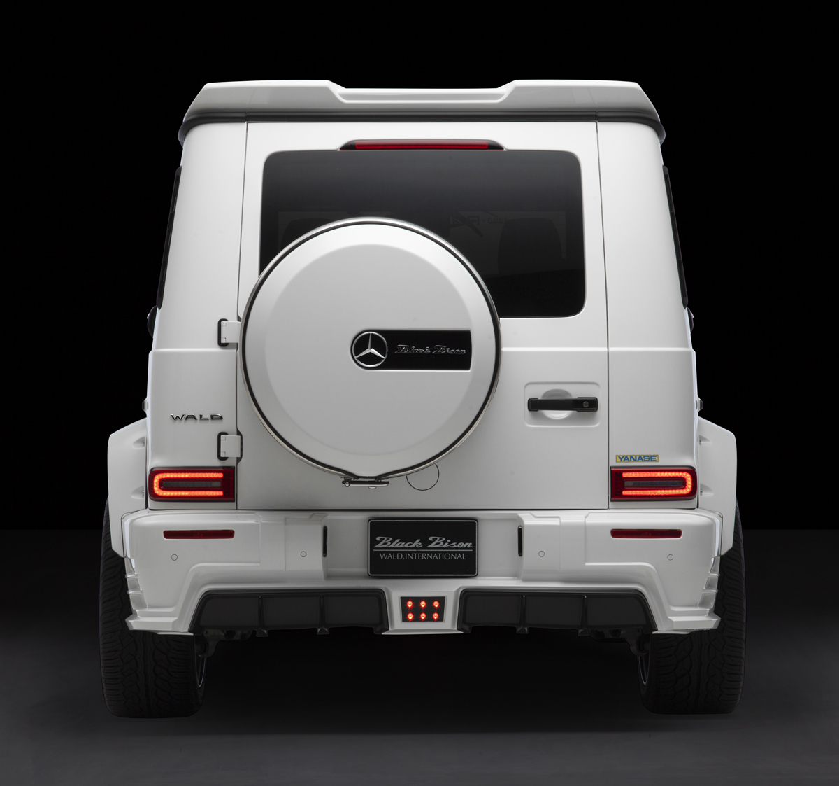WALD Black Bison Mercedes G-Class W463A head-on rear view — white G-Class with rear skirt diffuser and LED lamp