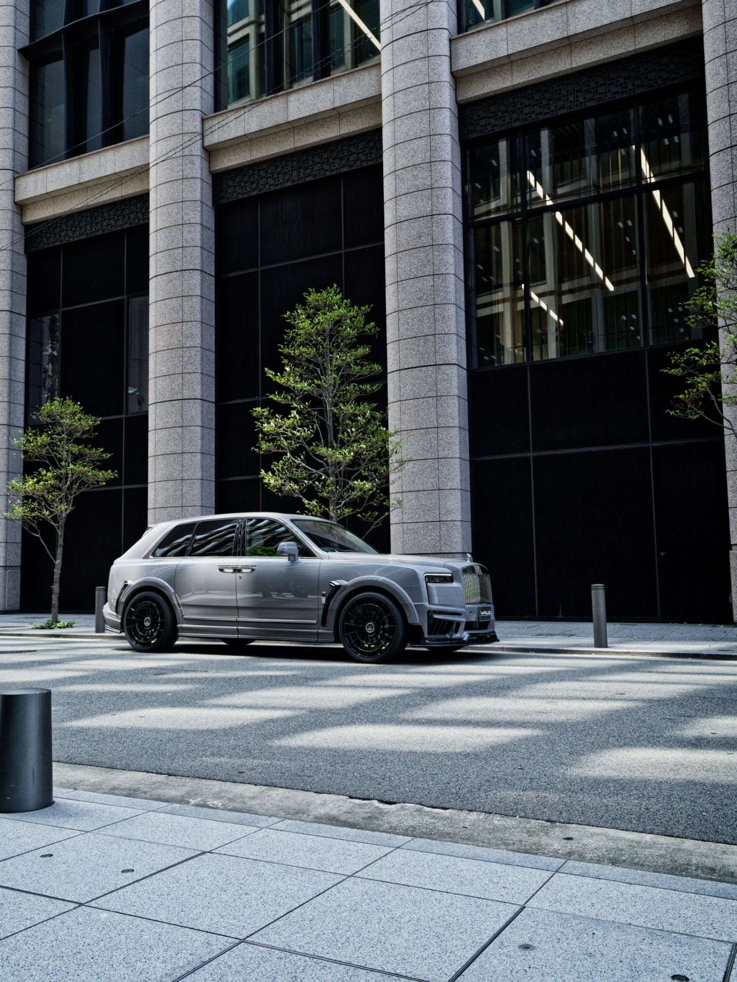 Grey WALD Rolls-Royce Cullinan on ZETTON Forged 24-inch wheels parked on a city street