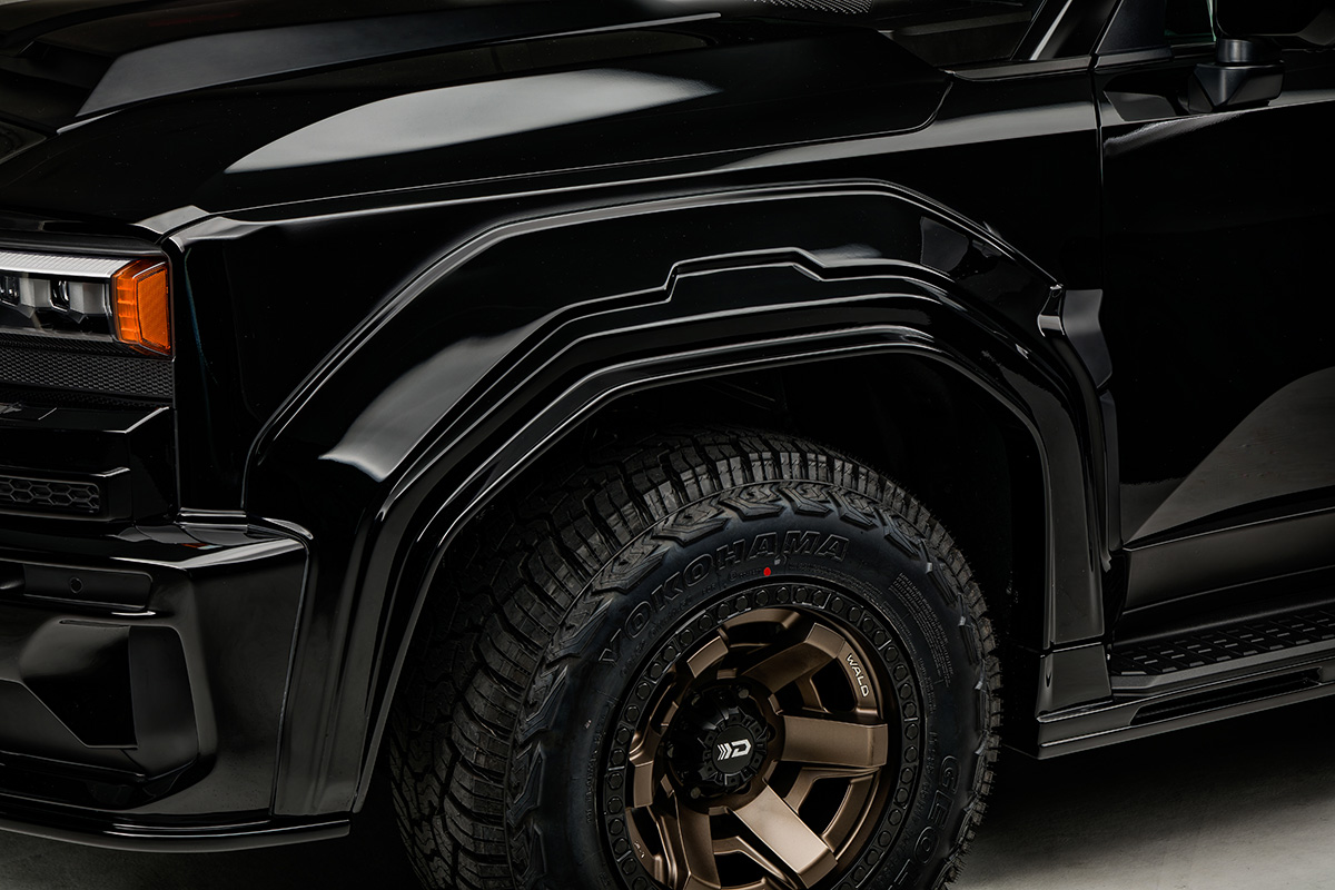 WALD Black Bison Land Cruiser 250 Prado front over-fender detail with bronze WALD wheel and Yokohama tyre