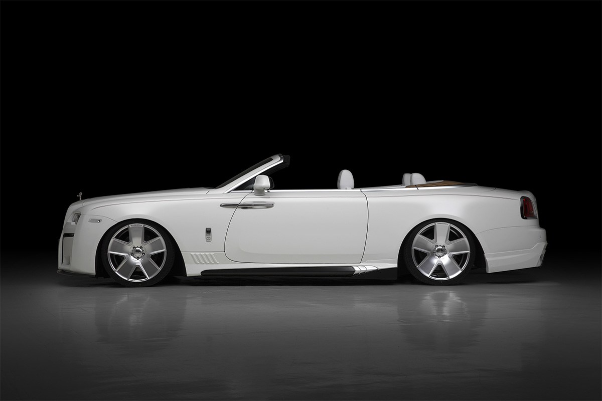Rolls-Royce Dawn WALD Black Bison — rear three-quarter view with rear skirt spoiler and WALD wheels