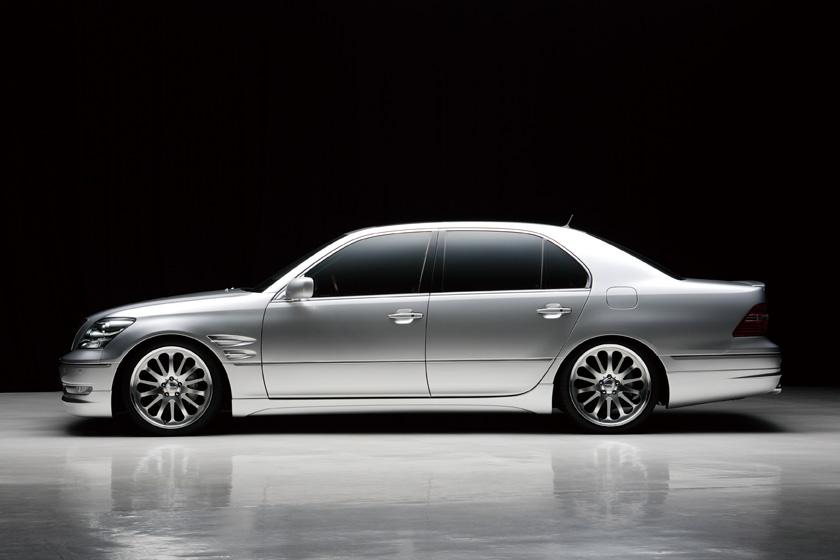 WALD Executive Line Toyota Celsior UCF30/31 — full side profile on a black studio background with complete WALD Executive Line body kit