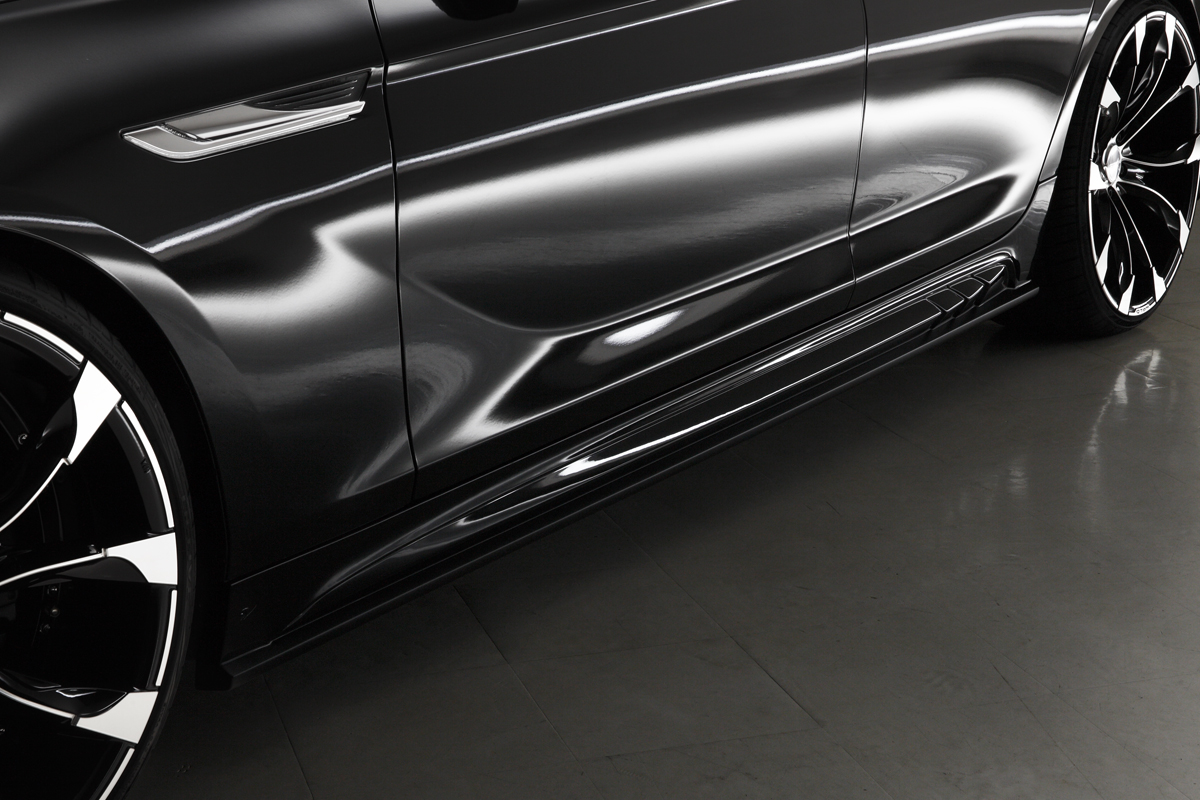 WALD BMW F06 body kit side skirt detail on black BMW 6 Series Gran Coupe with forged wheels