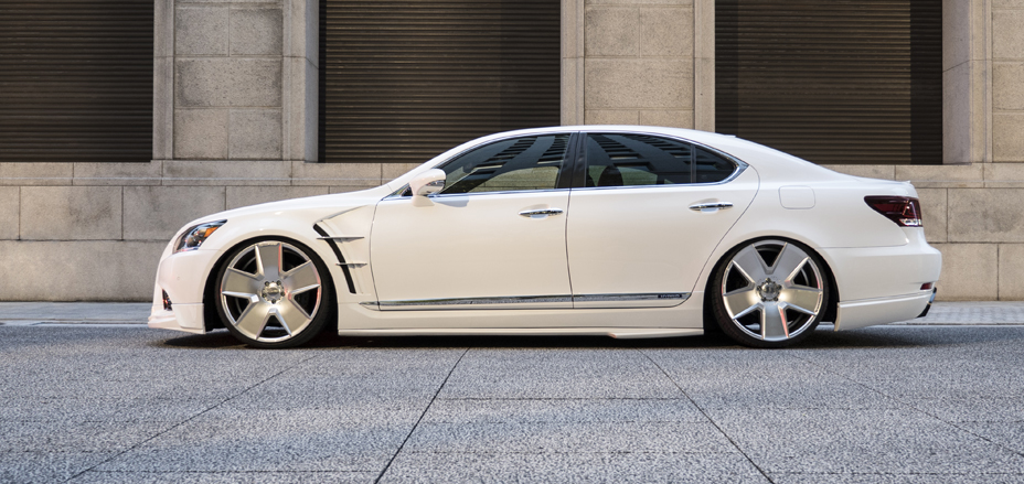 WALD Executive Line Lexus LS F SPORT in white side profile showing WALD side skirts and sports fender ducts