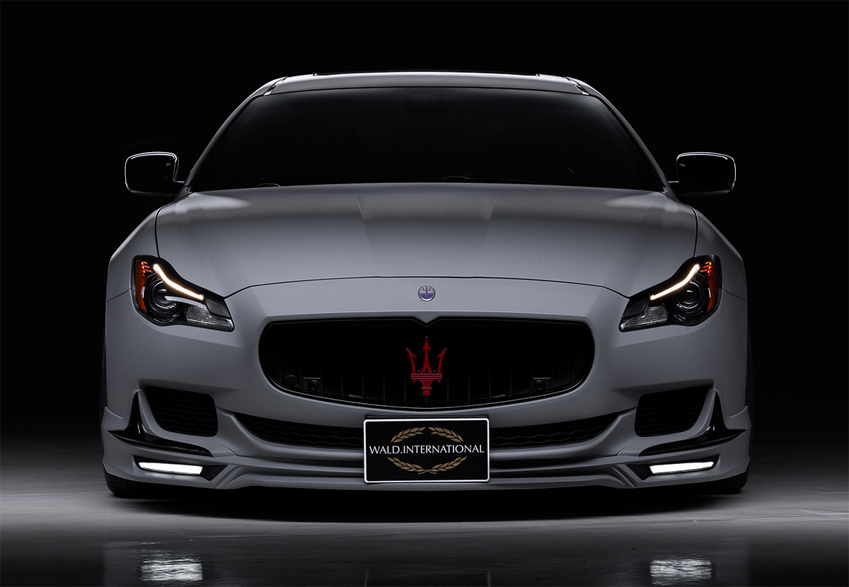 WALD Maserati Quattroporte body kit — head-on front view with WALD front spoiler and LED lamps