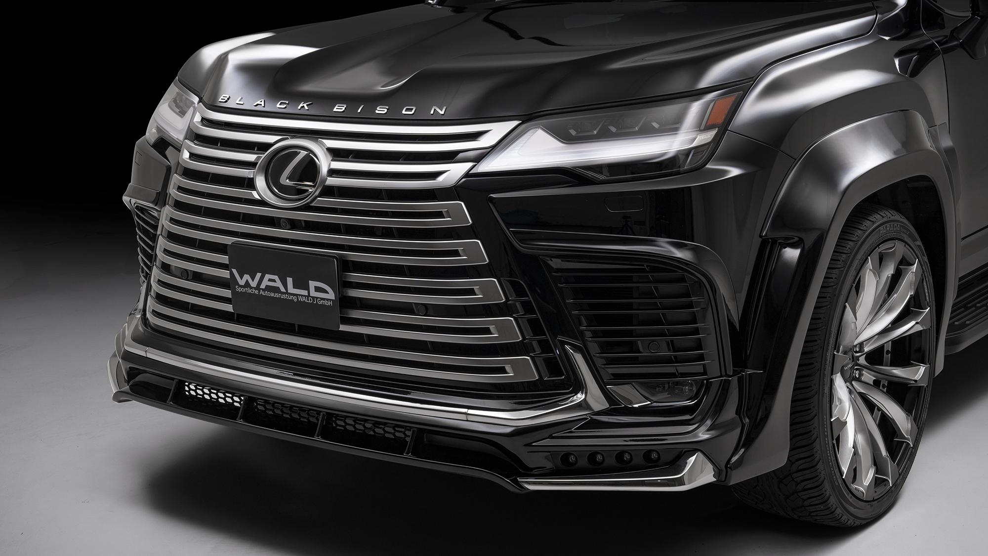 WALD Lexus LX600 front spoiler detail — ABS front spoiler with 5-piece chrome plated garnish set and LED lamp