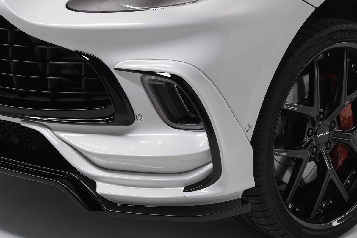 WALD Aston Martin DBX Black Bison front lip spoiler and bumper duct garnish detail with WALD forged wheel and red caliper