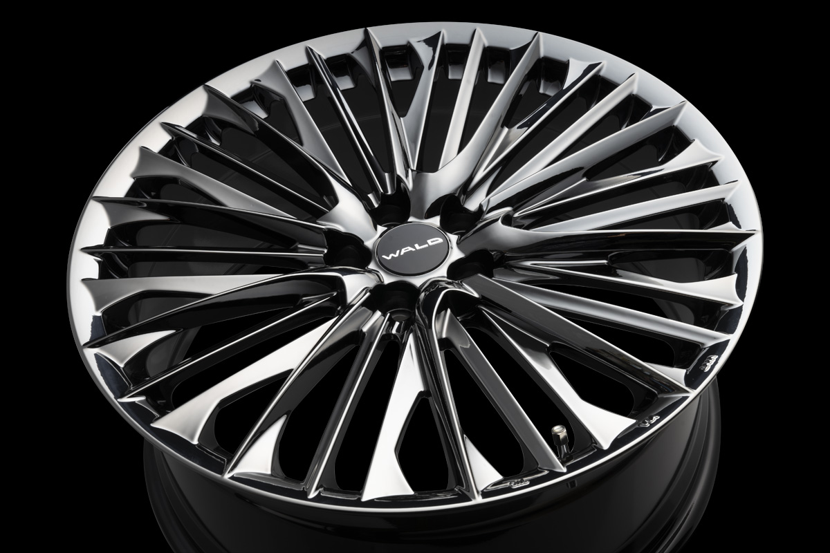 WALD Genuine Line F-001 1-piece wheel face in SBC Super Black Coat on a black studio background