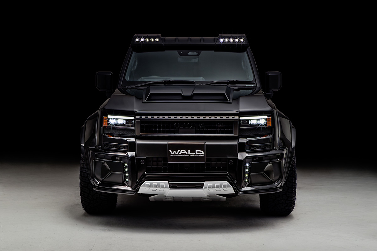 WALD Black Bison Land Cruiser 250 Prado head-on studio front view with front spoiler, bumper garnish and LED lamps